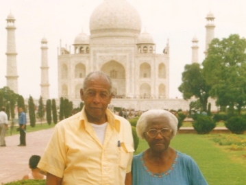 Grandpa and Grandma the explorers in India with the Taj behind him 